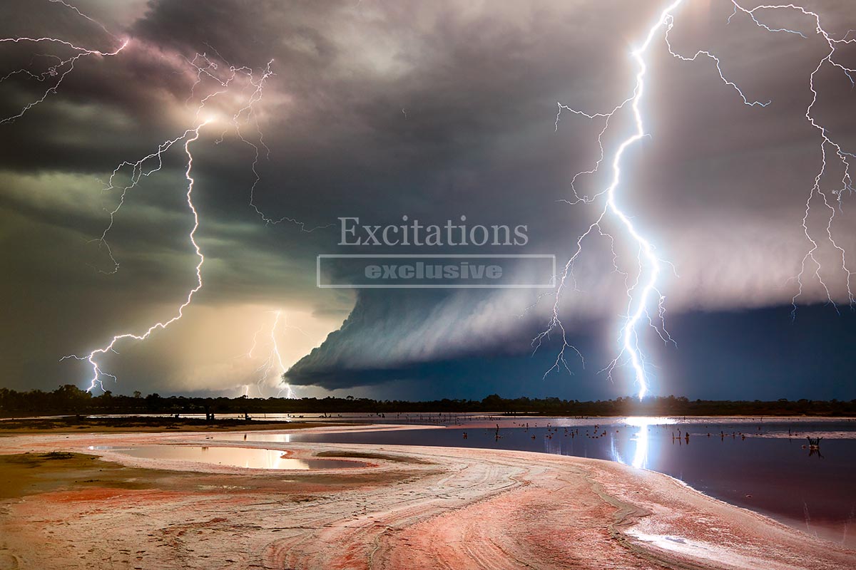 Spectacular lightning strike over salt lake outback Australia, in camera photograph, not digital manipulation, to illustrate blog post for outback photography about thunderstorm safety.